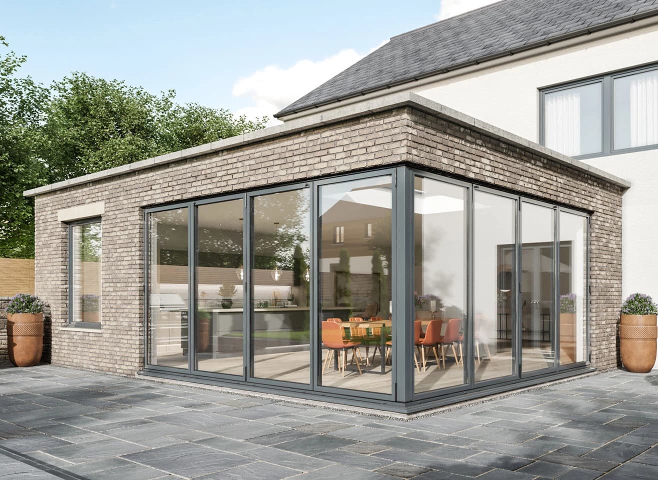 Premium anthracite grey aluminium bifold doors opening onto a modern patio